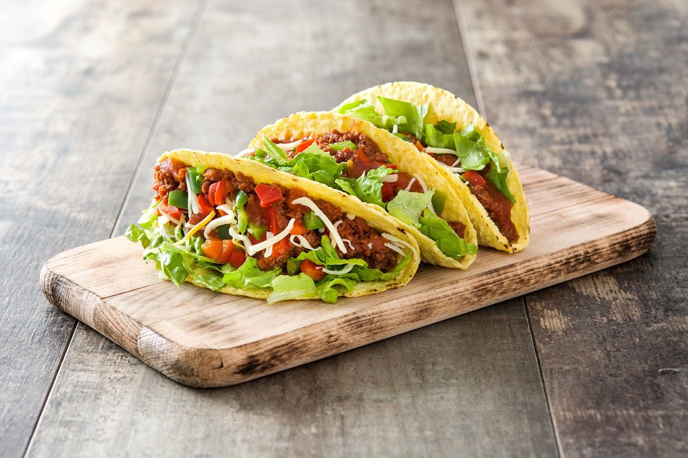 Traditional,Mexican,Tacos,With,Meat,And,Vegetables,On,Wooden,Background